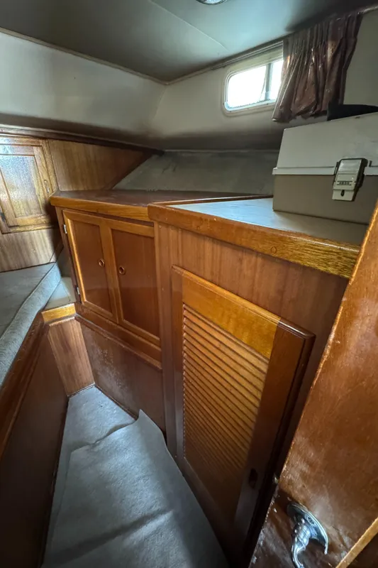 1979 Californian LRC Sedan Bridge interior with wooden cabinetry and compact storage space.