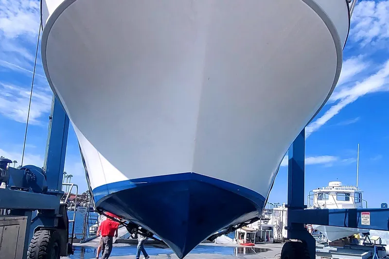 1979 Californian LRC Sedan Bridge boat in dry dock, blue sky background.