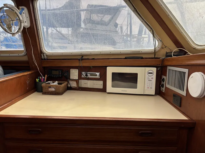 1973 CAL 246 boat interior with microwave, fan, and storage drawers.
