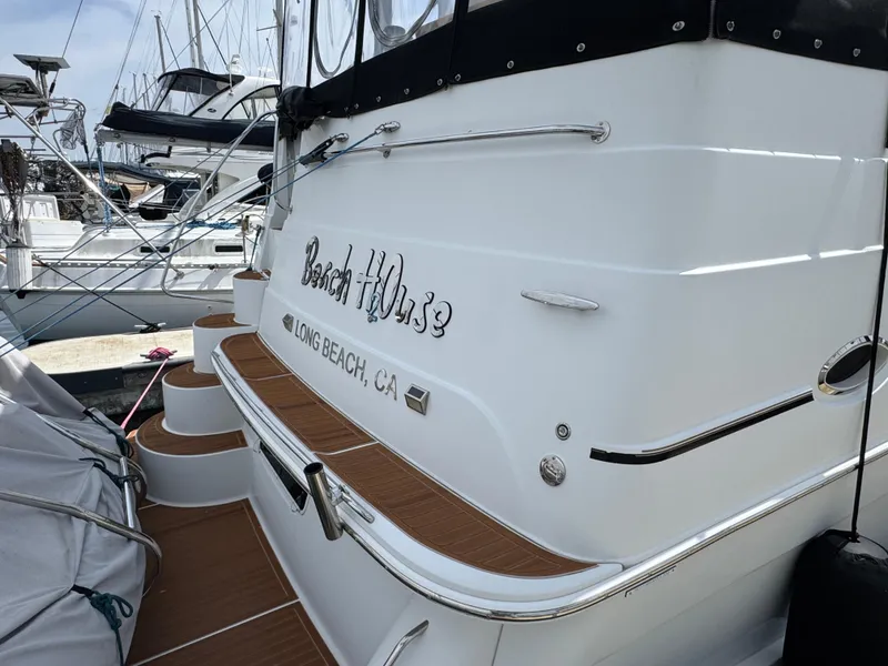 2004 Carver 366 Motor Yacht docked in Long Beach, CA, with teak steps and sleek design.