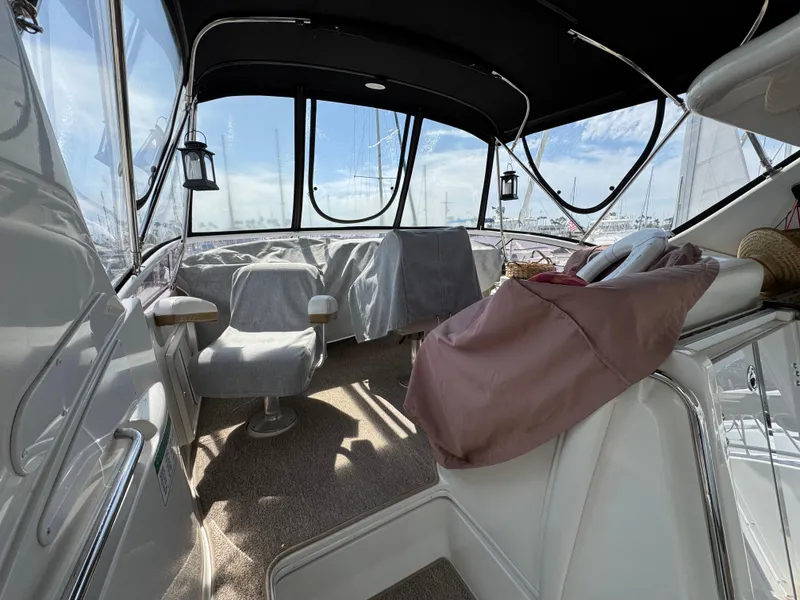 2004 Carver 366 Motor Yacht interior with seating and covered windows.