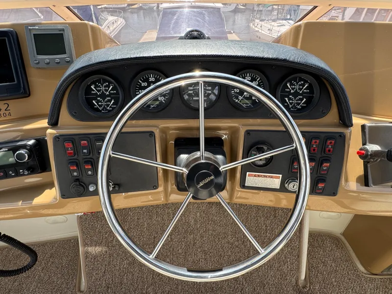 2004 Carver 366 Motor Yacht helm with steering wheel and instrument panel.