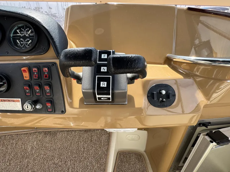 Control panel of a 2004 Carver 366 Motor Yacht with throttle and switches.