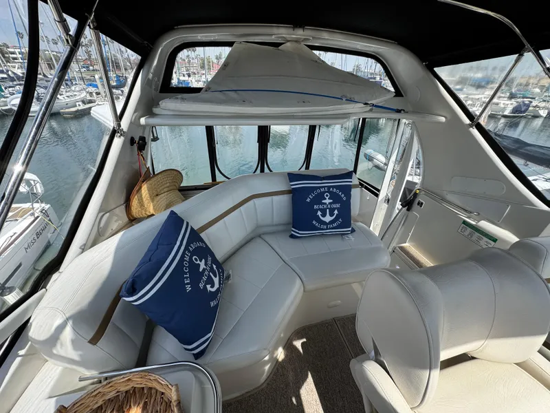 2004 Carver 366 Motor Yacht interior with plush seating and nautical-themed cushions.