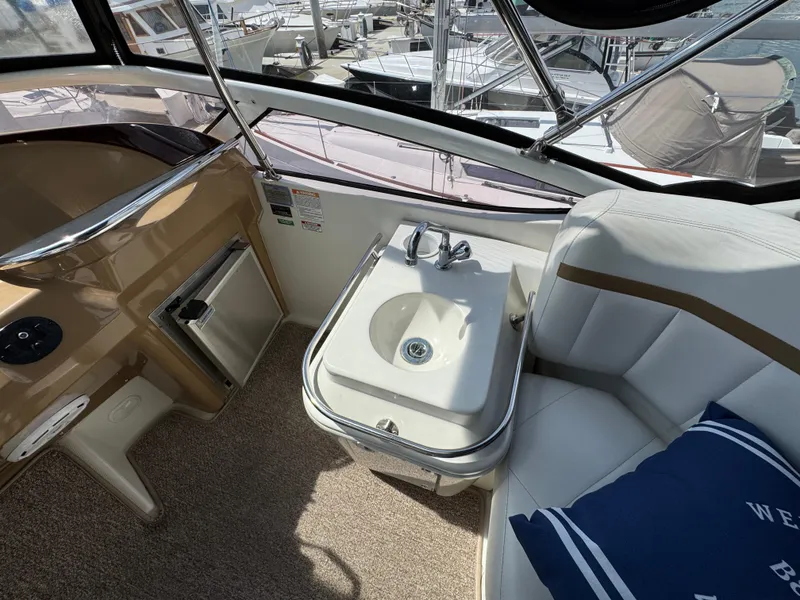 2004 Carver 366 Motor Yacht interior with sink, seating, and nautical decor.