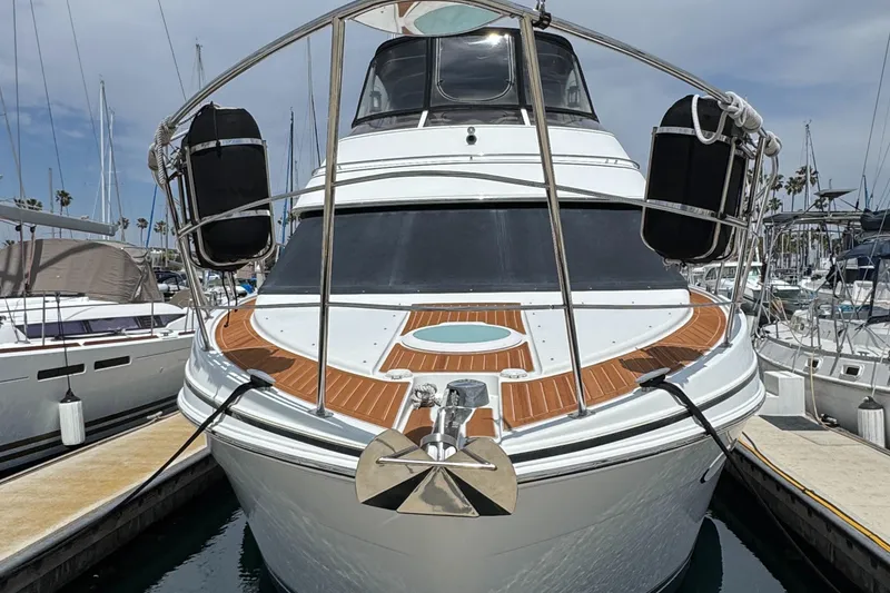 2004 Carver 366 Motor Yacht docked at marina, front view.