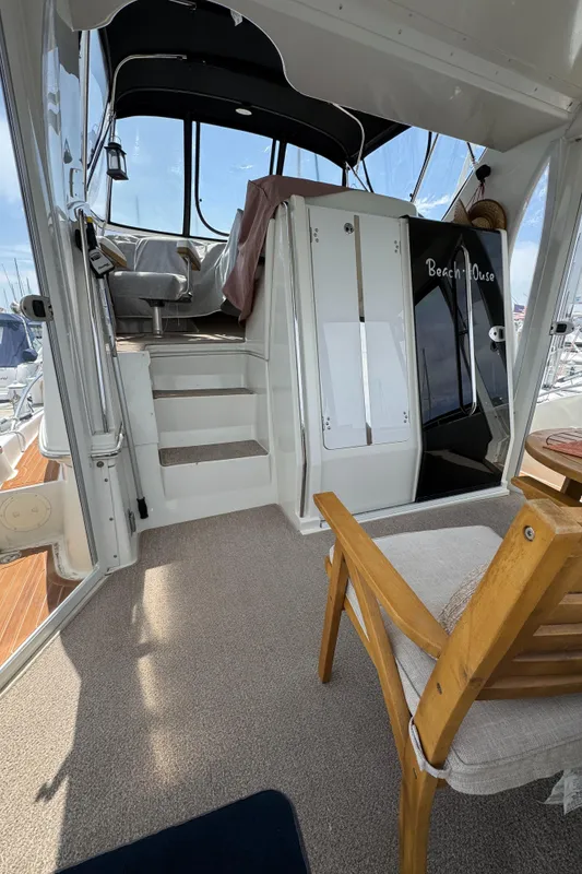 Interior of a 2004 Carver 366 Motor Yacht, featuring stairs and seating area.