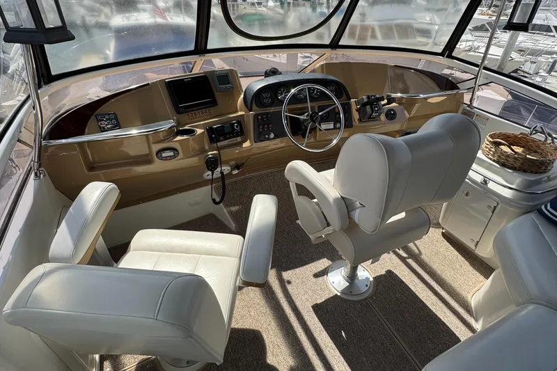 2004 Carver 366 Motor Yacht helm with beige interior and modern controls.