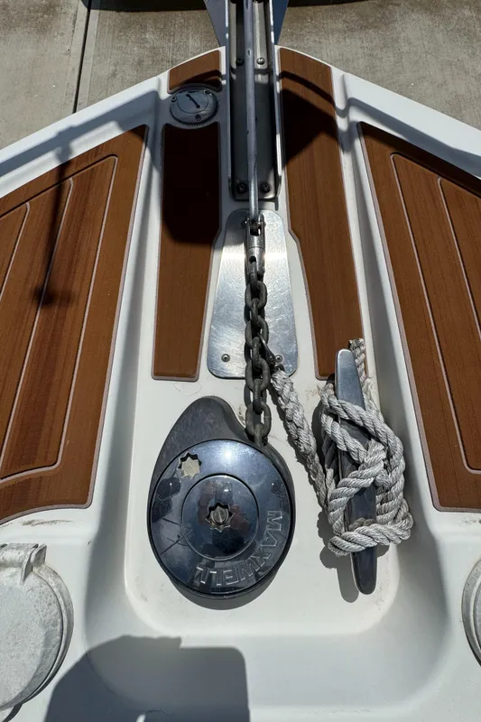 Bow of 2004 Carver 366 Motor Yacht with anchor chain and rope.