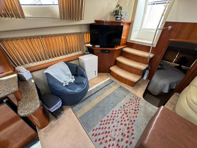 Interior of 2004 Carver 366 Motor Yacht with cozy seating and modern amenities.