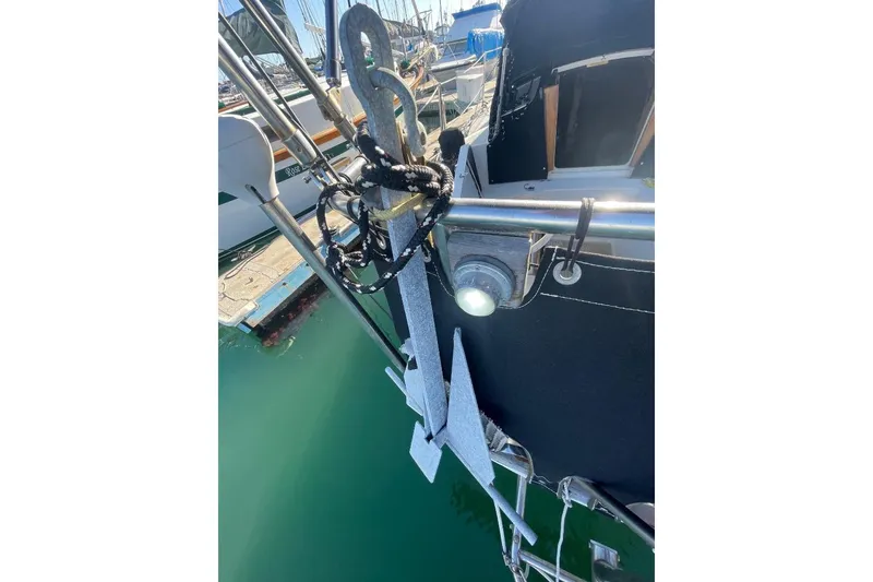 Custom Bodega 30 sailboat anchor detail, 1977 model, docked in marina.