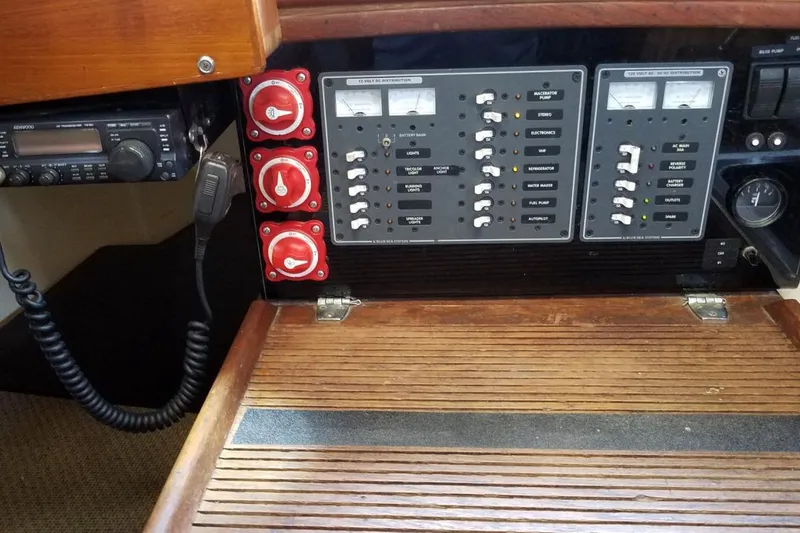 Electrical control panel on a 1977 Custom Bodega 30 boat with radio and switches.