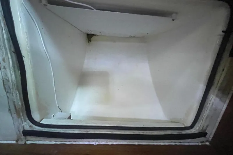 Empty interior of a vintage 1977 Custom Bodega 30 refrigerator.