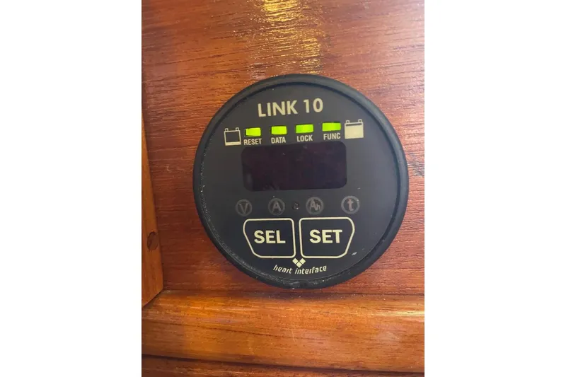 Digital display panel on a 1977 Custom Bodega 30 boat, featuring control buttons and indicators.