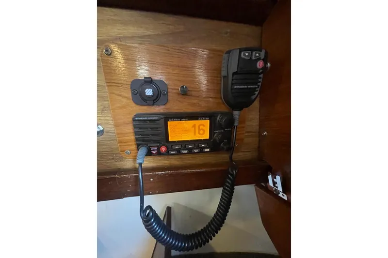 Vintage marine radio setup on 1977 Custom Bodega 30 boat, featuring Standard Horizon equipment.