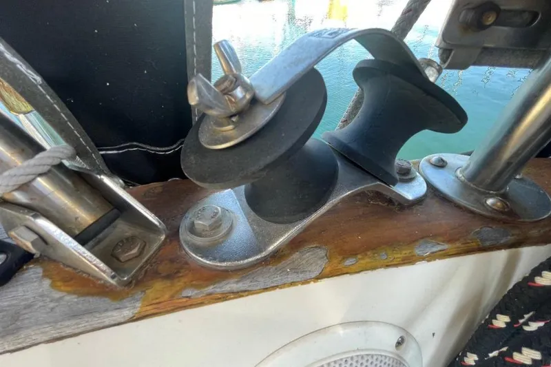 Close-up of a 1977 Custom Bodega 30 sailboat's deck hardware and fittings.