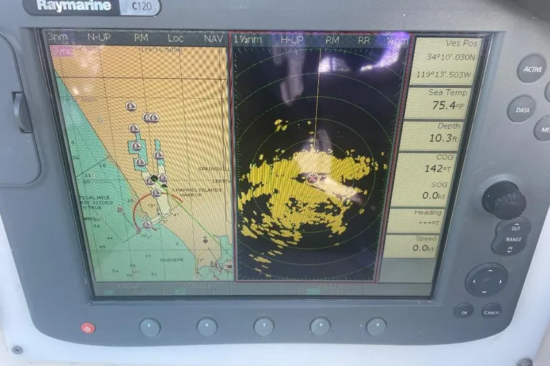 Raymarine C120 marine navigation display showing radar and chart data, Custom Bodega 30, 1977.
