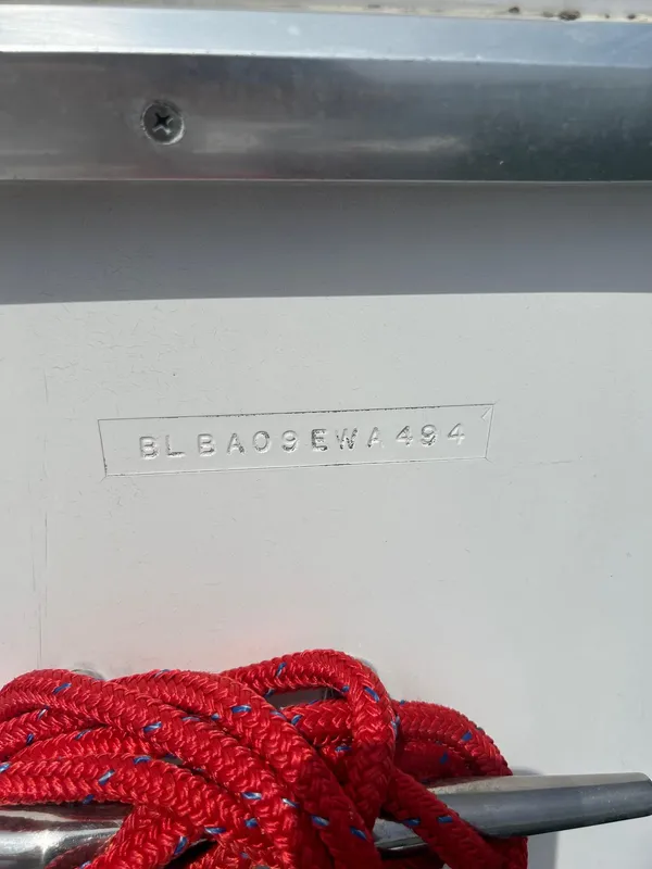 1994 Bayliner 4587 Motoryacht hull identification number with red rope detail.