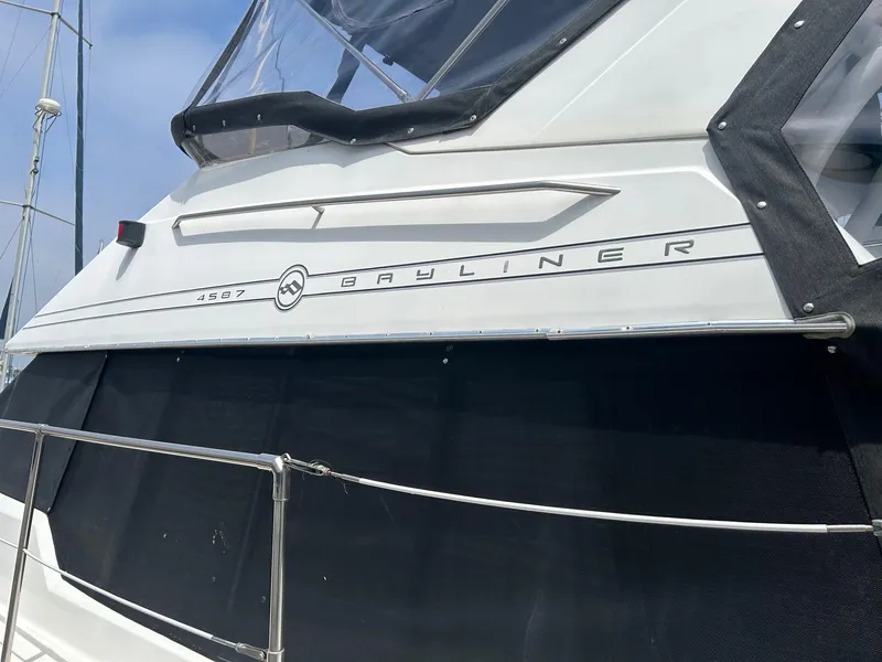 1994 Bayliner 4587 Motoryacht exterior with logo and railing, showcasing sleek design.
