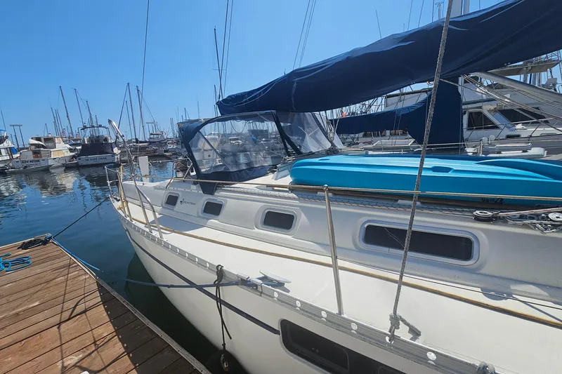 Beneteau Oceanis 440 sailboat docked at marina, 1996 model, sunny day.