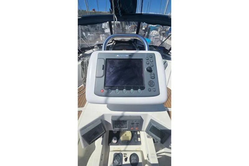 Cockpit of 1996 Beneteau Oceanis 440 sailboat with navigation equipment.
