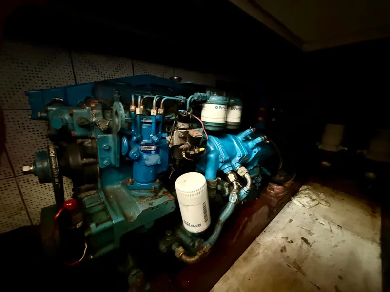 Engine room of 1981 DeFever Passagemaker with Perkins marine engine.