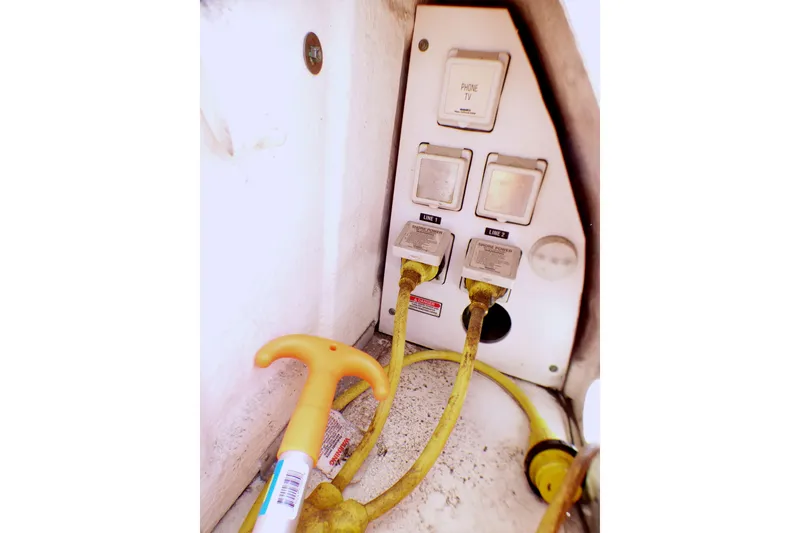 Electrical panel with yellow cables on a 2002 Sea Ray 340 Sundancer boat.