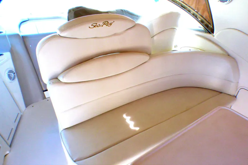 Luxurious seating on a 2002 Sea Ray 340 Sundancer boat interior.