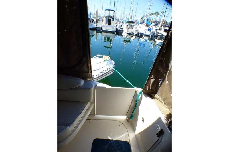2002 Sea Ray 340 Sundancer interior view with marina backdrop.