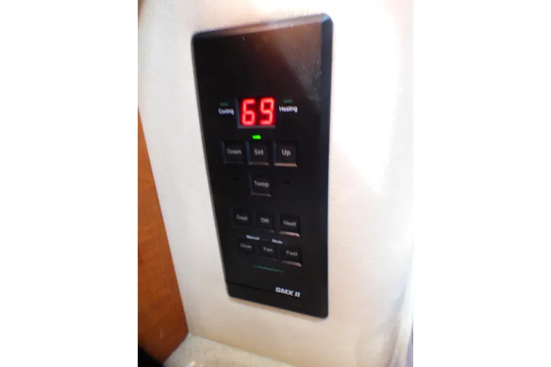 Digital thermostat panel on 2002 Sea Ray 340 Sundancer boat, displaying 69 degrees.