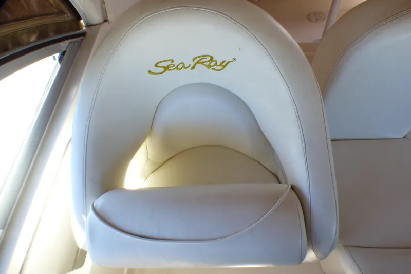 White leather seat with "Sea Ray" logo on a 2002 Sea Ray 340 Sundancer boat.
