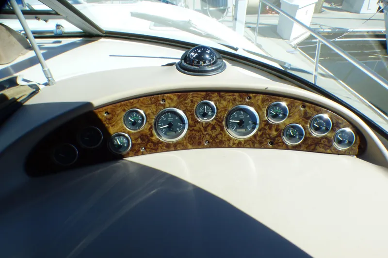 Dashboard of 2002 Sea Ray 340 Sundancer with gauges and compass.