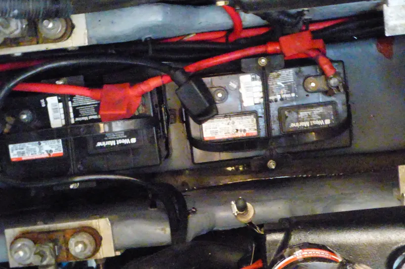 Battery compartment of a 2002 Sea Ray 340 Sundancer with visible wiring connections.