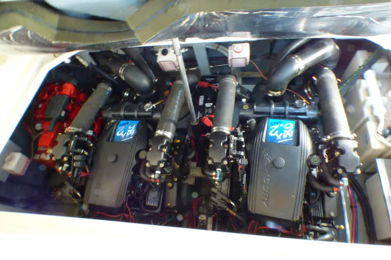 Engine compartment of a 2002 Sea Ray 340 Sundancer boat, showcasing dual engines.