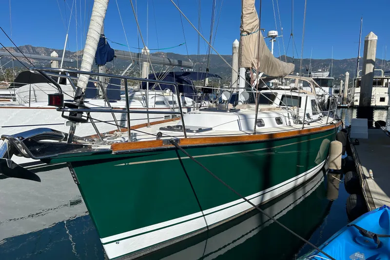 2003 Tartan 4400 LS sailboat docked at marina with clear blue sky.