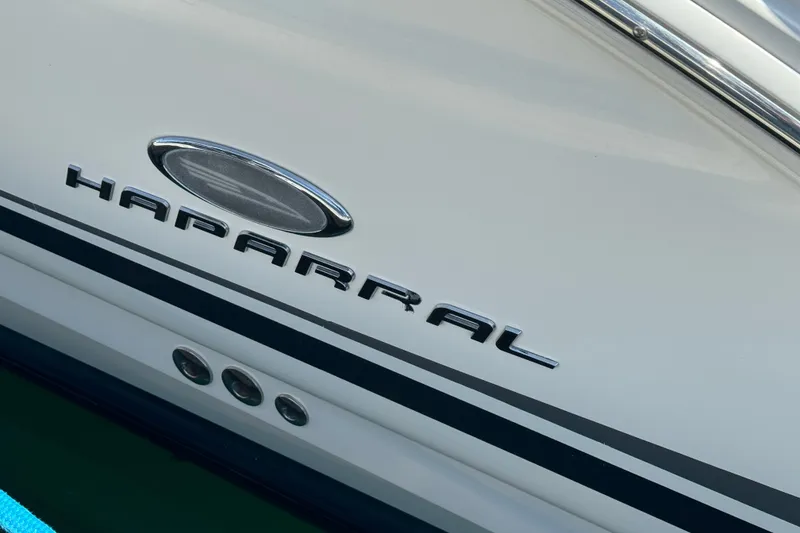 2006 Chaparral Signature 350 boat logo on white hull with chrome accents.