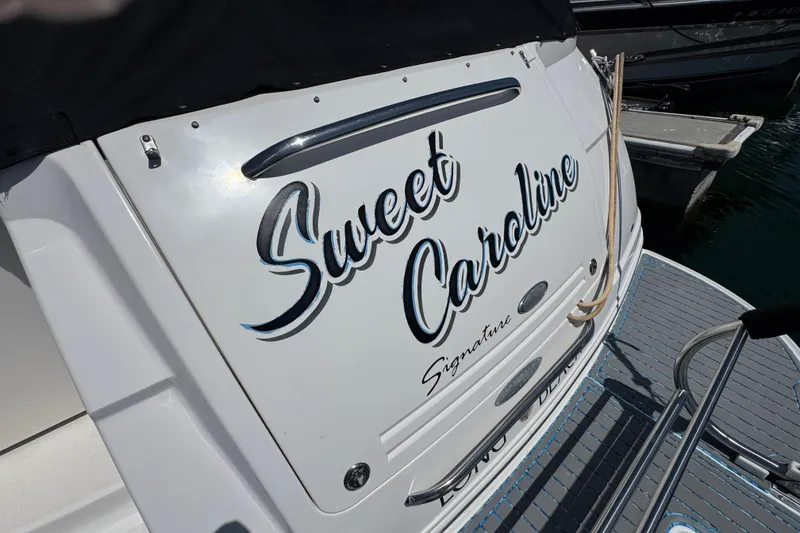 2006 Chaparral Signature 350 boat named "Sweet Caroline" docked at marina.