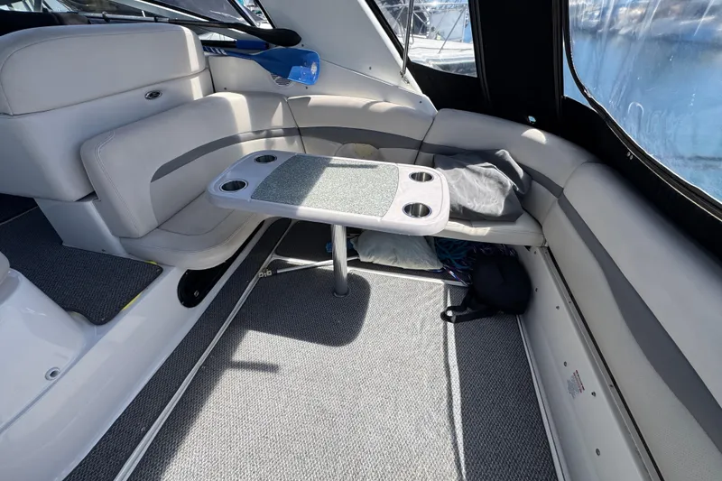 Interior of 2006 Chaparral Signature 350 boat with seating and table setup.