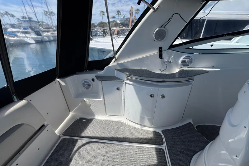 2006 Chaparral Signature 350 boat interior with sink and seating, docked at marina.