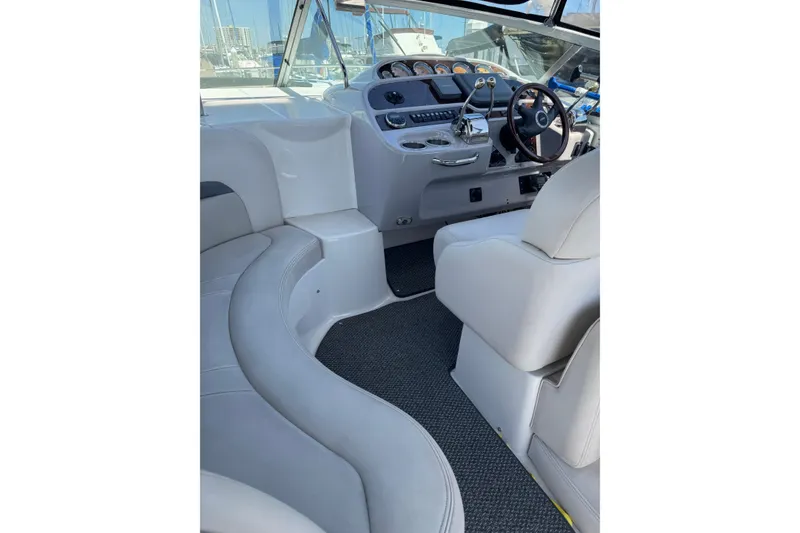 Interior of 2006 Chaparral Signature 350 boat with helm and seating area.