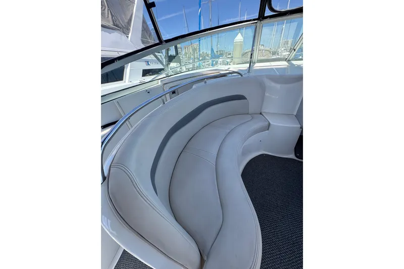2006 Chaparral Signature 350 boat interior with curved seating and marina view.