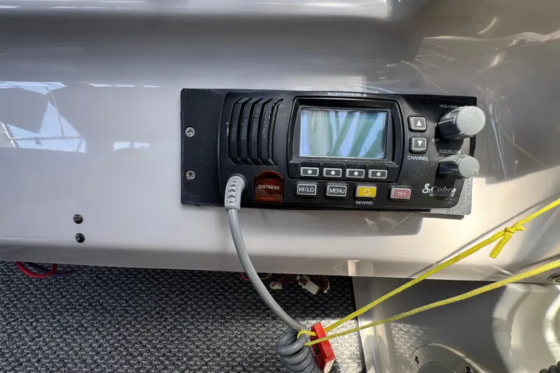 VHF radio system on 2006 Chaparral Signature 350 boat dashboard.