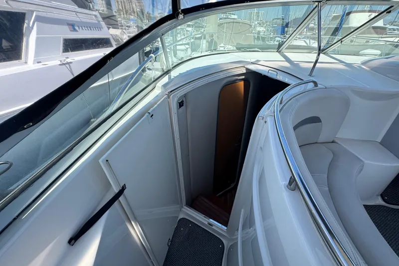2006 Chaparral Signature 350 boat interior with open cabin door and seating area.