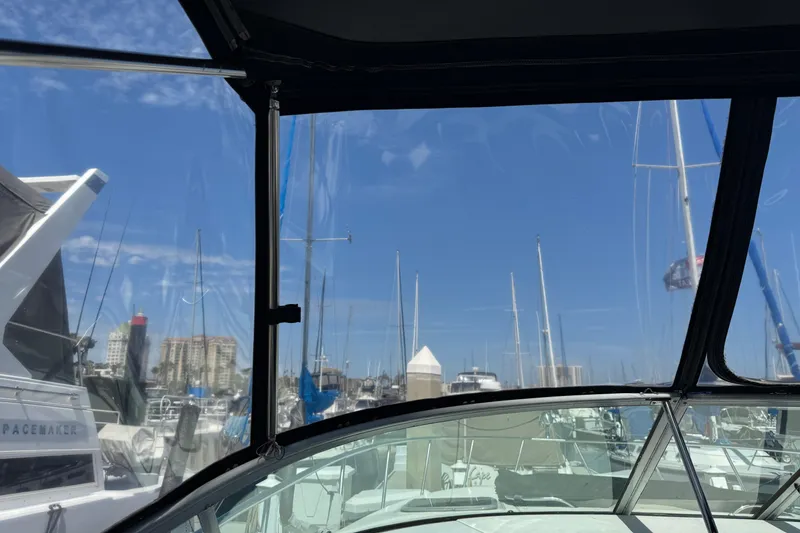 View from 2006 Chaparral Signature 350 boat, overlooking marina with clear blue sky.