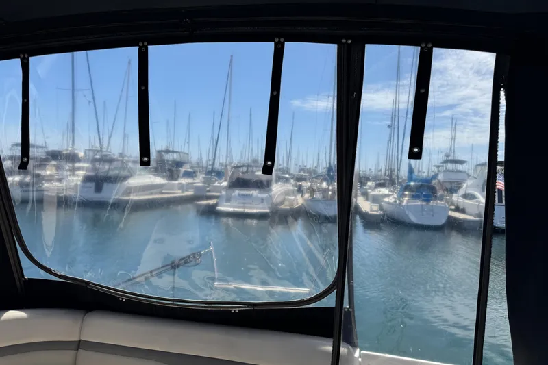 View from Chaparral Signature 350, 2006, overlooking marina with docked boats.