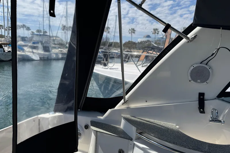 2006 Chaparral Signature 350 boat interior with marina view and clear skies.