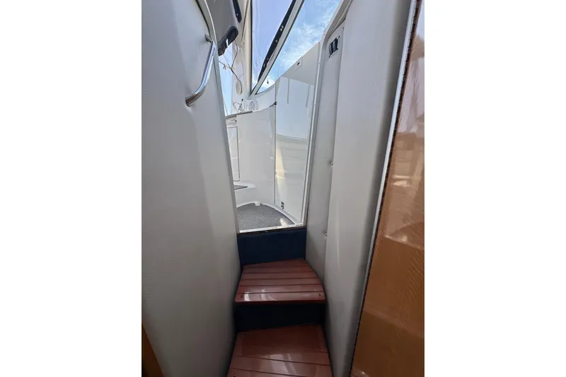 Stairway inside 2006 Chaparral Signature 350 yacht, leading to deck area.
