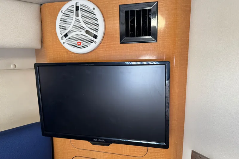 Interior of 2006 Chaparral Signature 350 with TV, speaker, and vent.