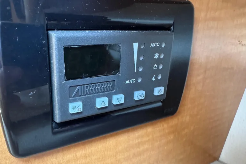 Control panel of a 2006 Chaparral Signature 350 boat, featuring various function buttons.