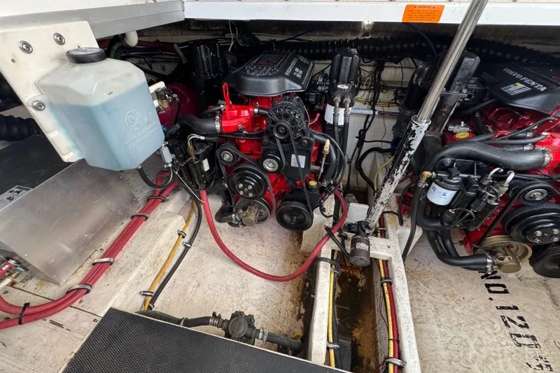 Engine compartment of a 2006 Chaparral Signature 350 boat, showcasing mechanical components.